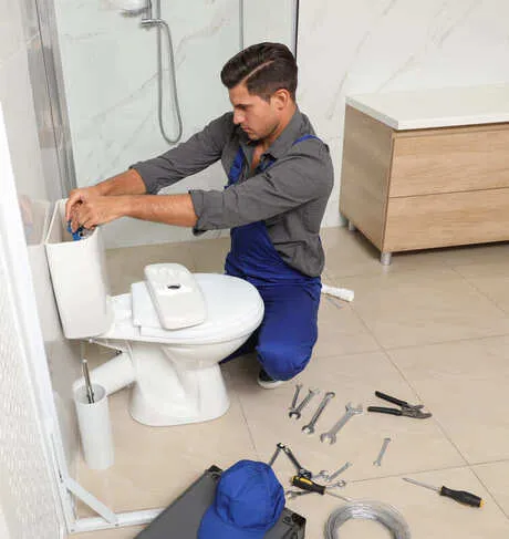 plumber-fixing-toilet